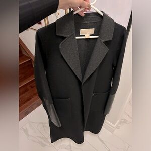 Black and grey coat with faux leather on sleeves.